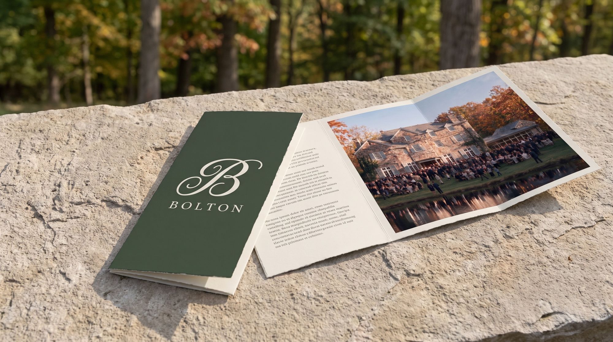 An open Bolton brochure on a stone wall