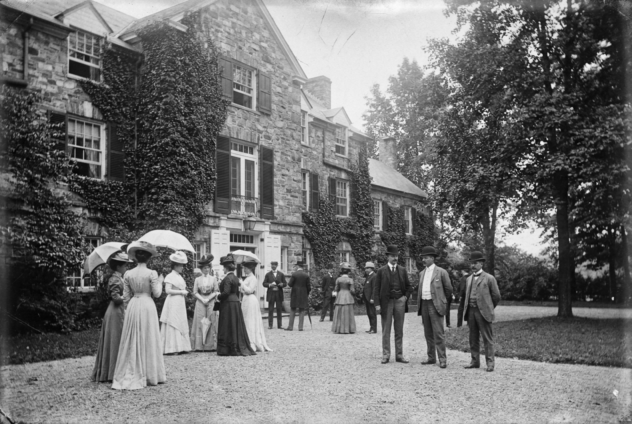 A historic gathering outside the ivy-covered manor