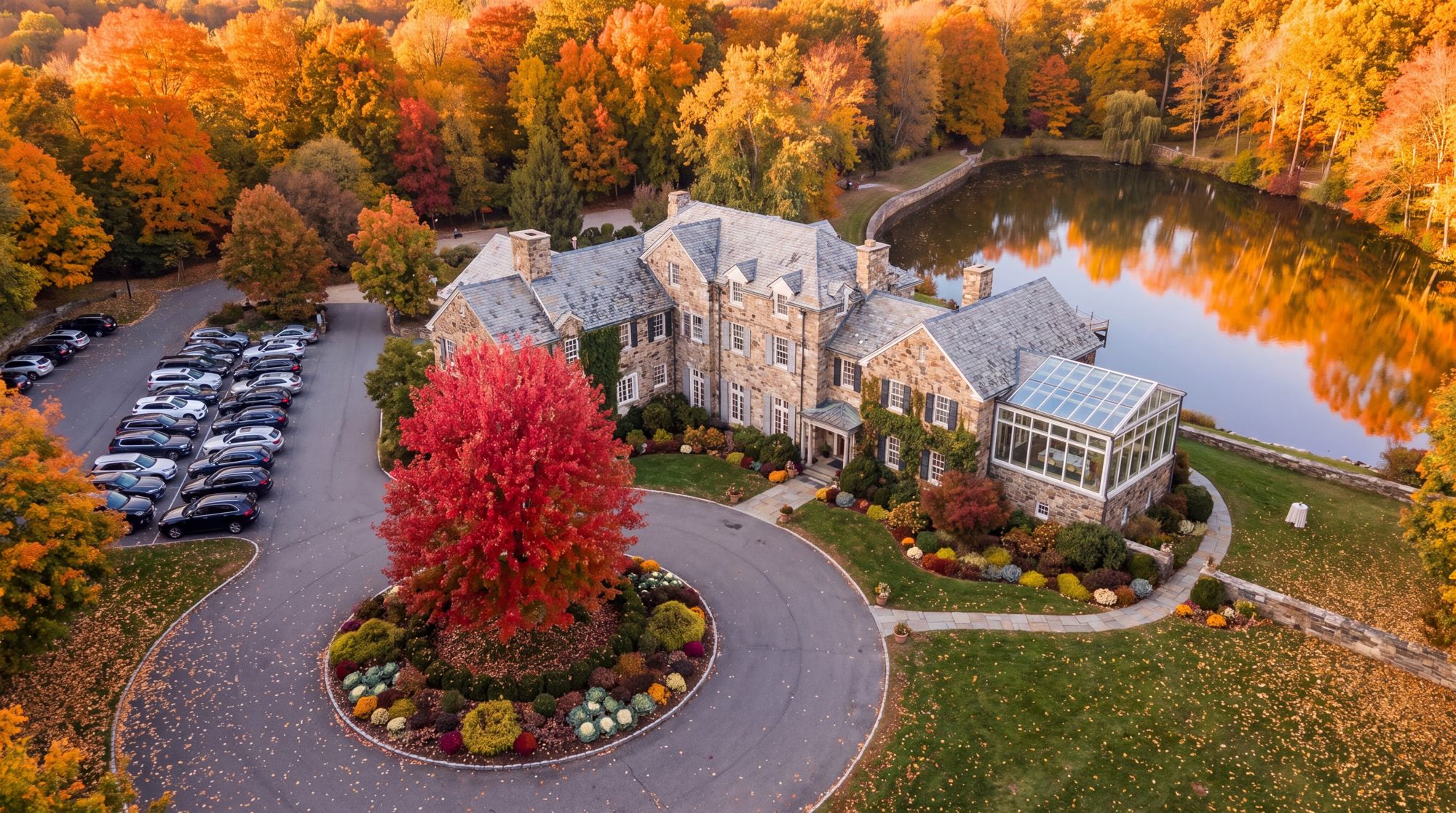 Aerial view of the Bolton manor, pond and grounds in autumn
